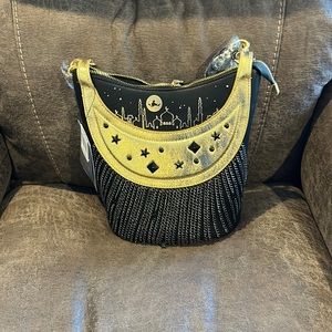 Disney’s park Danielle Nicole black Aladdin purse  gold trim attachable strap